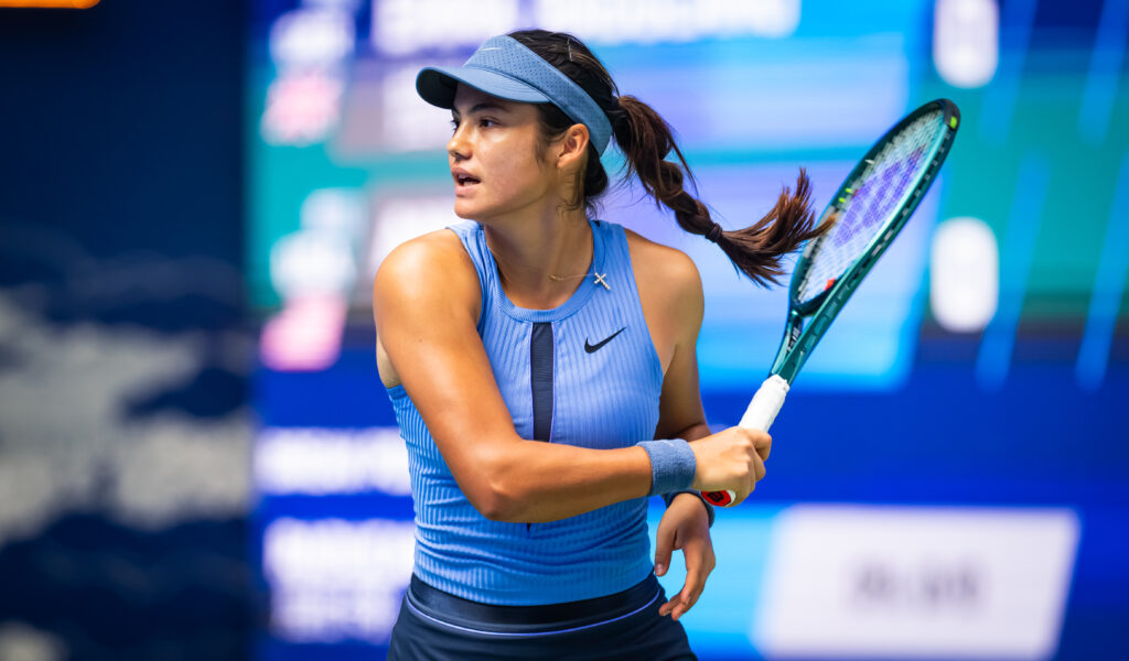 Emma Raducanu of Great Britain in action against Ann Li of the United States in the first round on Day 4 of the Wuhan Open at Optics Valley International Tennis Center on October 07, 2025 in Wuhan, China