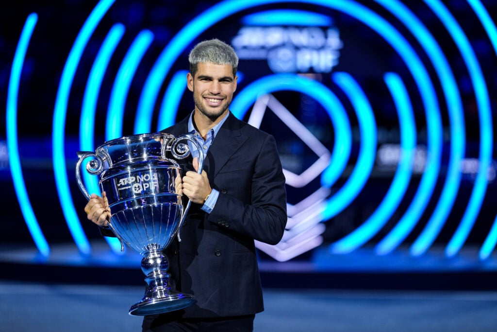 Carlos Alcaraz of Spain holds the 2025 ATP World Tour No. 1 trophy during day six of the Nitto ATP Finals 2025 at Inalpi Arena on November 14, 2025 in Turin, Italy.