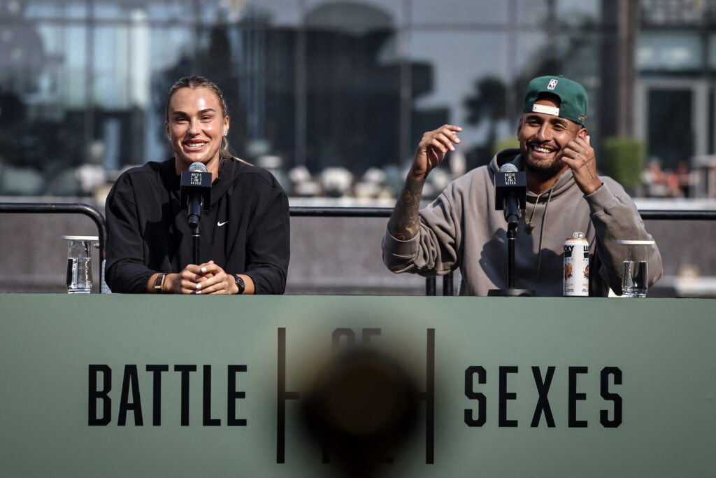 Belarus' Aryna Sabalenka (L) and Australia's Nick Kyrgios react during a press conference on the eve of the Battle of the Sexes exhibition match between Sabalenka and Kyrgios at Atlantis The Royal, in Dubai on December 27, 2025.
