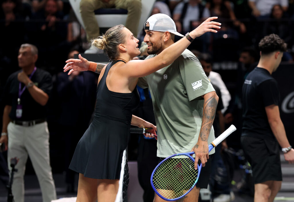 Aryna Sabalenka and Nick Kyrgios of Australia embrace at the net after the Battle of the Sexes match between Aryna Sabalenka and Nick Kyrgios of Australia at Coca-Cola Arena on December 28, 2025 in Dubai, United Arab Emirates.