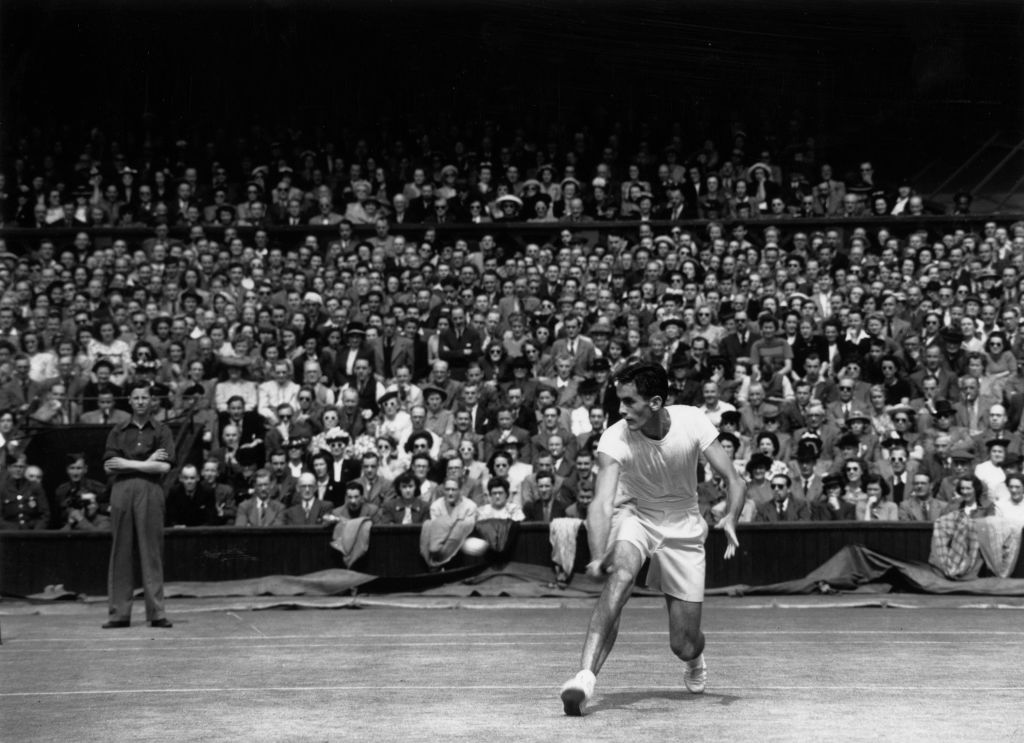 Bob Falkenburg of the USA playing John Bromwich of Australia in the men's singles final on centre court at the Wimbledon Lawn Tennis Championships.