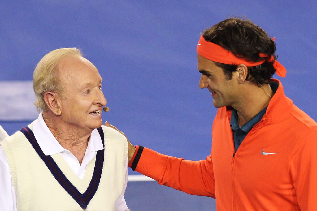 Roger Federer of Switzerland (R) and Australian tennis legend Rod Laver embrace during the Roger Federer Charity match at Melbourne Park on January 8, 2014 in Melbourne, Australia.