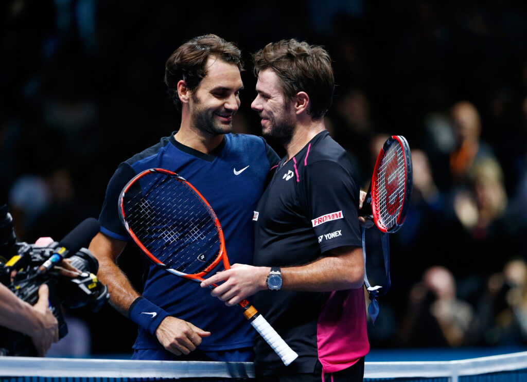 Roger Federer of Switzerland shakes hands with Stanislas Wawrinka of Switzerland after his victory in their men's semi final on day seven of the Barclays ATP World Tour Finals at the O2 Arena on November 21, 2015 in London, England.