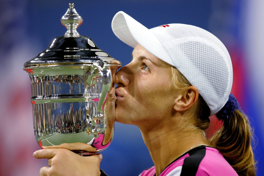 Svetlana Kuznetsova of Russia kisses the trophy after defeating Elena Dementieva of Russia in the women's final during the US Open