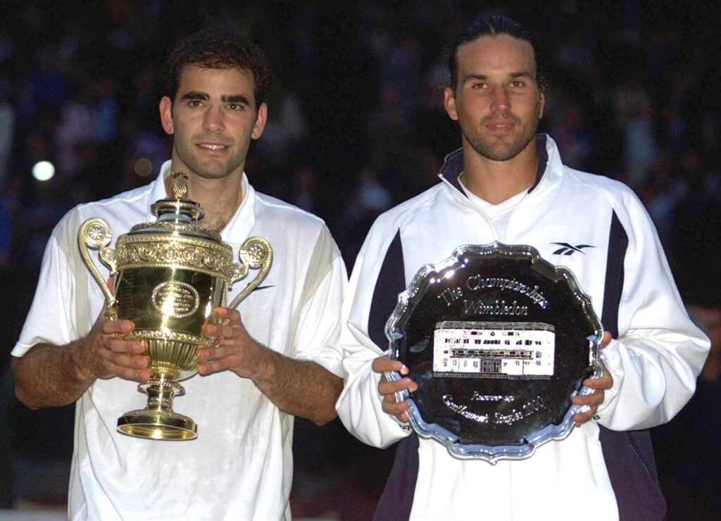 Pete Sampras and Pat Rafter pose with their trophies