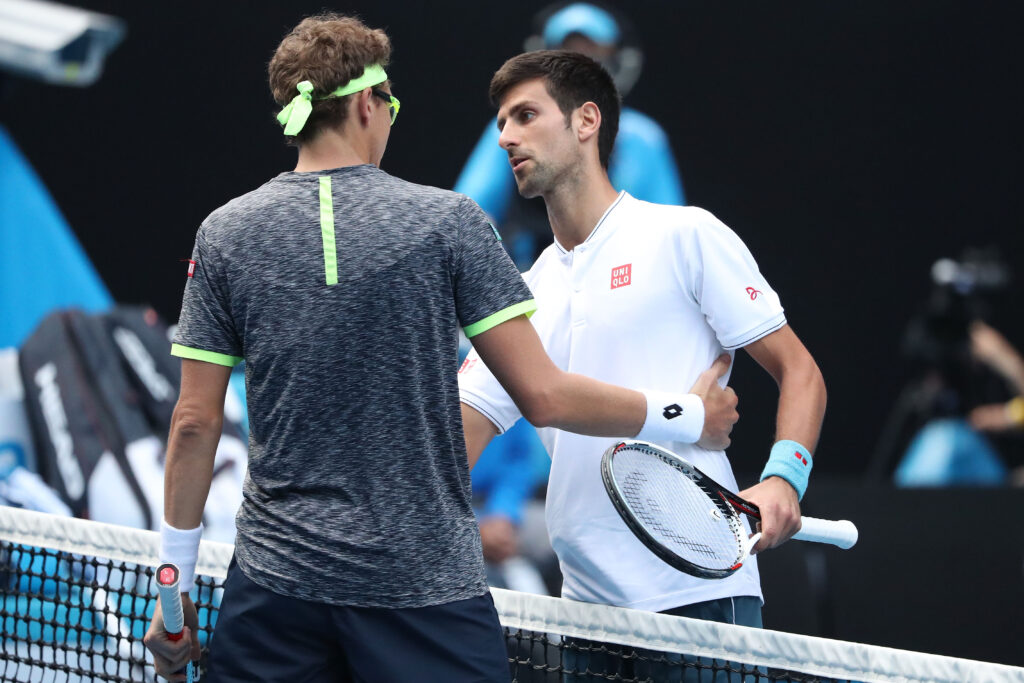 Novak Djokovic of Serbia congratulates Denis Istomin of Uzbekistan after winning their second round match on day four of the 2017 Australian Open at Melbourne Park on January 19, 2017 in Melbourne, Australia.