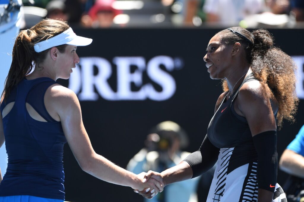 Serena Williams of the US (R) shakes hands with Britain's Johanna Konta after winning their women's singles quarter-final match on day ten of the Australian Open tennis tournament in Melbourne on January 25, 2017.