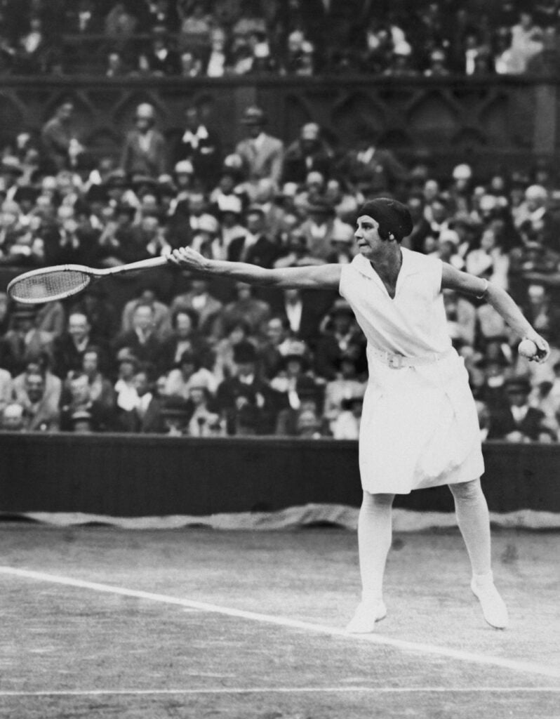 Australian tennis player Daphne Akhurst Cozens (1903 - 1933) in play at Wimbledon, 1928.