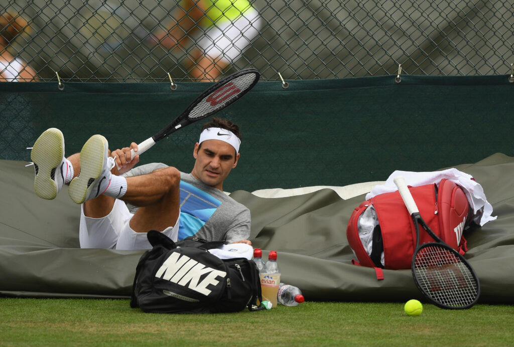 Roger Federer of Switzerland takes a break during practice at Wimbledon on July 1, 2017 in London, England.