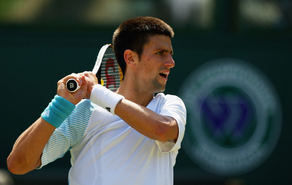 Novak Djokovic of Serbia plays a forehand during the men's singles round two match against Marat Safin of Russia on day three of the Wimbledon Lawn Tennis Championships at the All England Lawn Tennis and Croquet Club on June 25, 2008 in London, England.