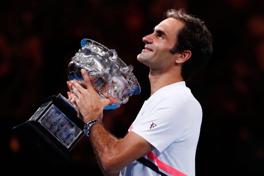 Roger Federer of Switzerland poses with the Norman Brookes Challenge Cup after winning the 2018 Australian Open Men's Singles Final against Marin Cilic of Croatia on day 14 of the 2018 Australian Open at Melbourne Park on January 28, 2018 in Melbourne, Australia