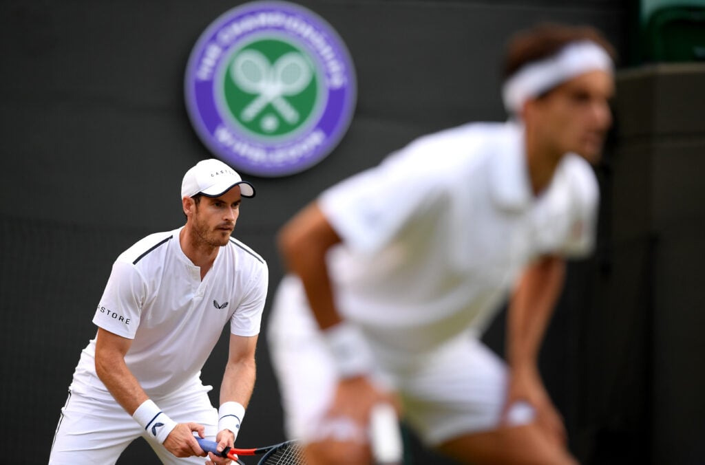 Andy Murray of Great Britain, partner of Pierre-Hughes Herbert of France prepares to return a serve during their Men's Doubles first round match against Marius Copil of Romania and Ugo Humbert of France during Day four of The Championships - Wimbledon 2019 at All England Lawn Tennis and Croquet Club on July 04, 2019 in London, England.