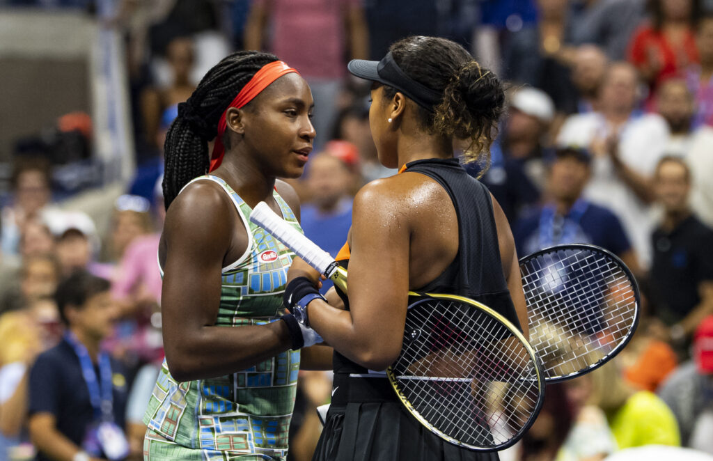 Coco Gauff of the United States is consoled by Naomi Osaka of Japan after Osaka beat her in the third round on Arthur Ashe Stadium at the USTA Billie Jean King National Tennis Center on August 31, 2019 in New York City.
