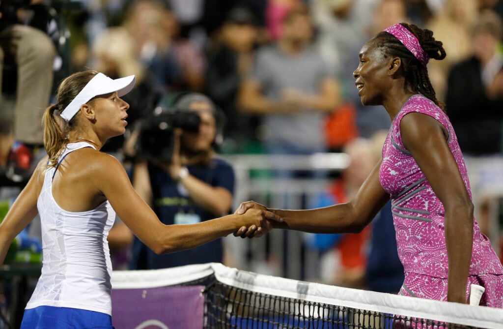 Venus Williams shakes hands with Magda Linette after Williams won 6-3, 6-7, 6-2 for their second round match at the Bank of the West Classic tennis tournament at the Taube Family Tennis Stadium in Stanford, Calif., on Wednesday, July 20, 2016