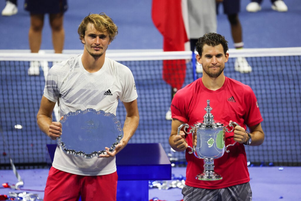 Alexander Zverev of Germany celebrates with his finalist trophy alongside Dominic Thiem of Austria with his championship trophy after Thiem won in a tie-breaker during their Men's Singles final match on Day Fourteen of the 2020 US Open at the USTA Billie Jean King National Tennis Center on September 13, 2020 in the Queens borough of New York City.