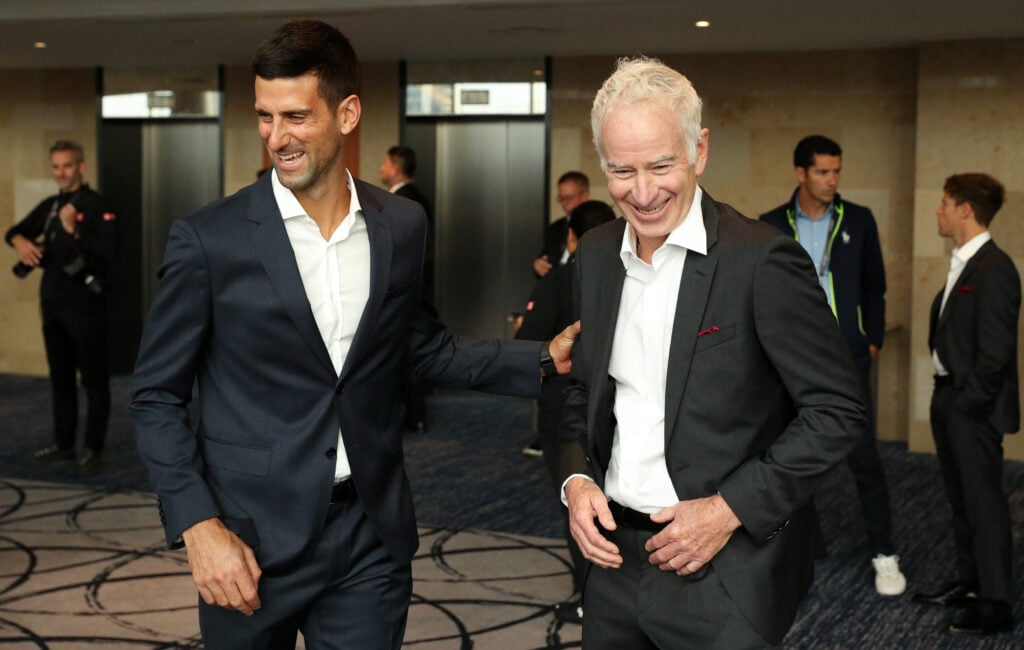 Novak Djokovic and John McEnroe laugh