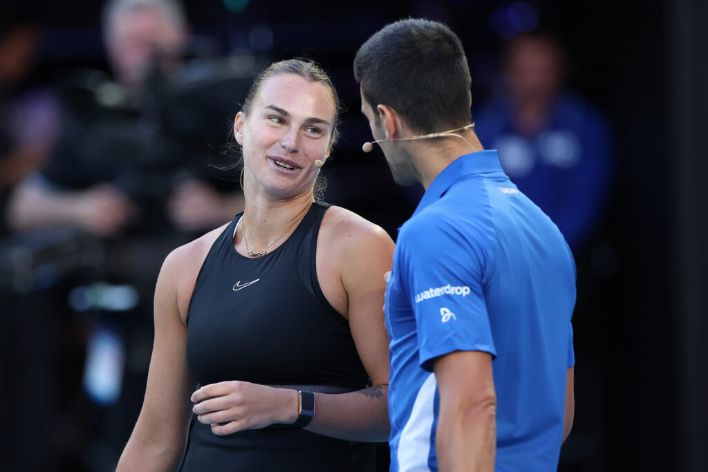 Aryna Sabalenka and Novak Djokovic react during a charity match ahead of the 2024 Australian Open at Melbourne Park on January 11, 2024 in Melbourne, Australia.