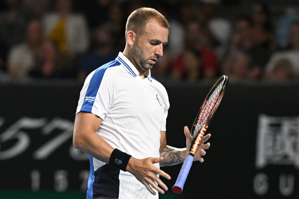 TENNIS-AUS-OPENBritain's Daniel Evans prepare to serve against Italy's Lorenzo Sonego during their men's singles match on day three of the Australian Open tennis tournament in Melbourne on January 16, 2024.
