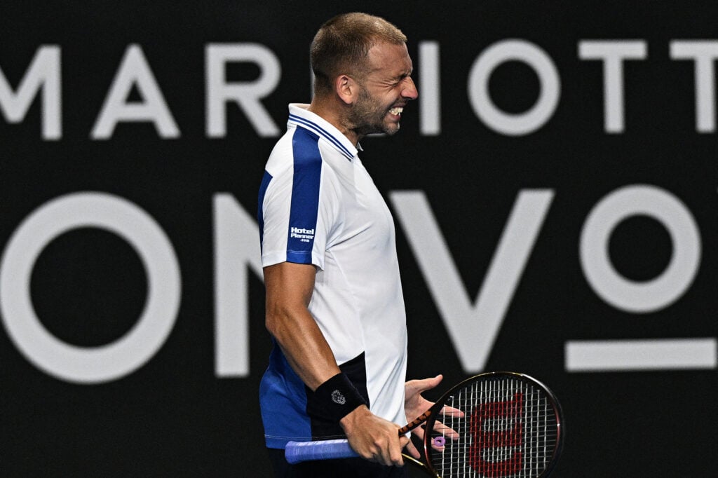 Britain's Daniel Evans reacts on a point against Italy's Lorenzo Sonego during their men's singles match on day three of the Australian Open tennis tournament in Melbourne on January 16, 2024.