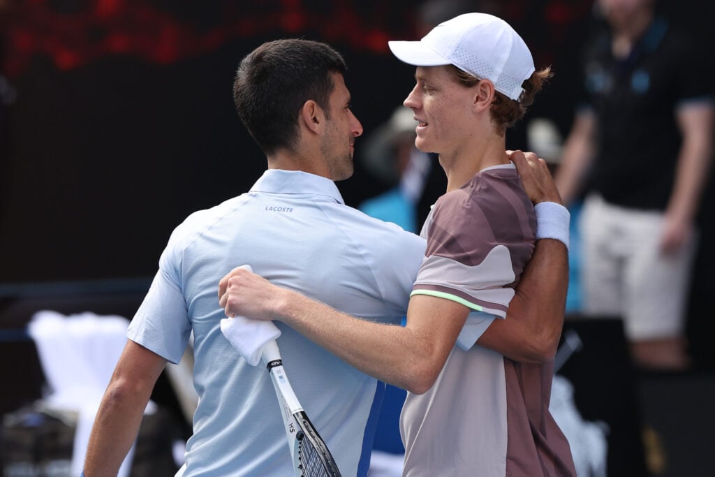 Jannik Sinner of Italy shakes hands with Novak Djokovic of Serbia in their Semifinal singles match during the 2024 Australian Open at Melbourne Park on January 26, 2024 in Melbourne, Australia.