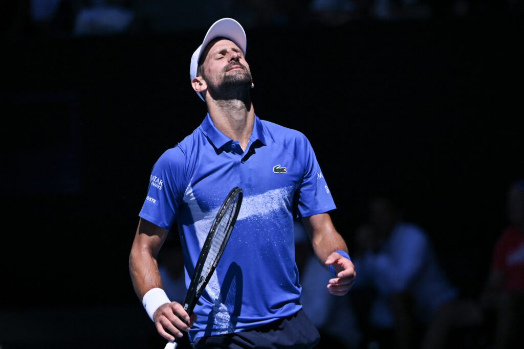 Serbia's Novak Djokovic reacts on a point against Germany's Alexander Zverev during their men's singles semi-final match on day thirteen of the Australian Open tennis tournament in Melbourne on January 24, 2025.