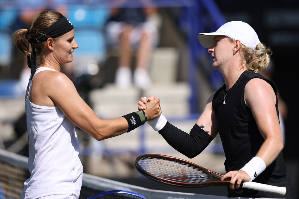 Greet Minnen of Belgium meets Francesca Jones of Great Britain at the net following defeat during the Women's Singles First Round match on Day One of the Lexus Eastbourne Open at Devonshire Park on June 23, 2025 in Eastbourne, England.