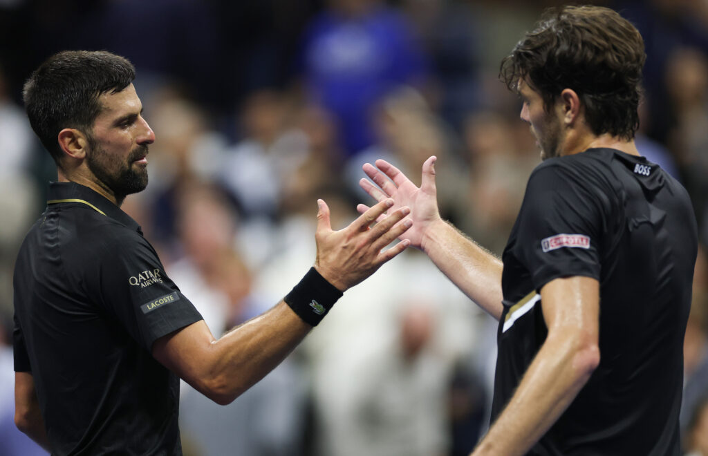 Novak Djokovic of Serbia shakes hands after defeating Taylor Fritz of the United States during their Men's Quarterfinal match on Day Ten of the 2025 US Open at USTA Billie Jean King National Tennis Center on September 2, 2025 in the Flushing neighborhood of the Queens borough of New York City.