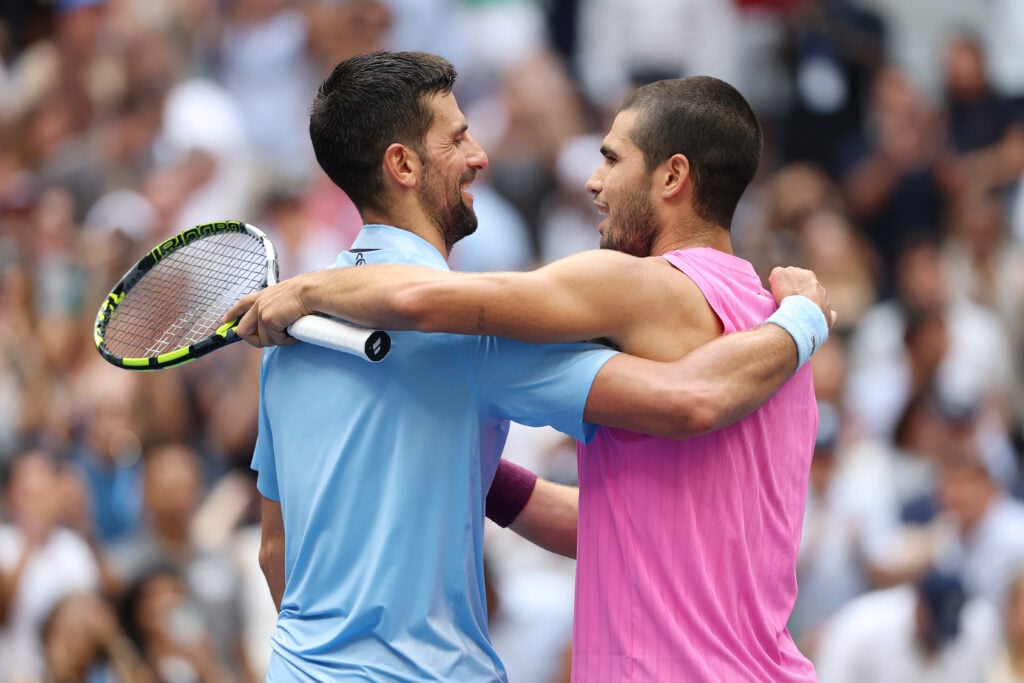 Carlos Alcaraz of Spain (R) greets Novak Djokovic of Serbia (L) following their Men's Semifinal match on Day Thirteen of the 2025 US Open at USTA Billie Jean King National Tennis Center on September 5, 2025 in the Flushing neighborhood of the Queens borough of New York City.