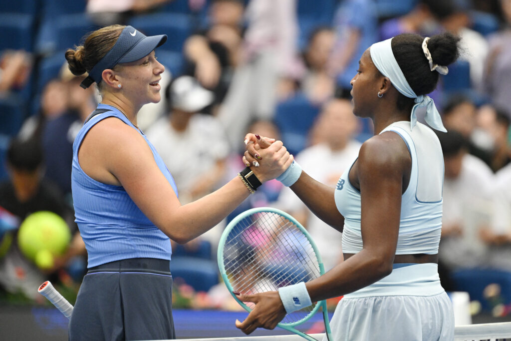 USA's Amanda Anisimova (L) is congratulated by USA's Coco Gauff after Anisimova won their women's singles semi-final match at the China Open tennis tournament in Beijing on October 4, 2025.