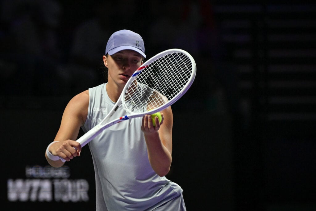 Iga Swiatek of Poland plays against Elena Rybakina of Kazakhstan during their group-stage match on Day 3 of the 2025 WTA Finals at King Saud University Indoor Arena in Riyadh, Saudi Arabia, on November 3, 2025.