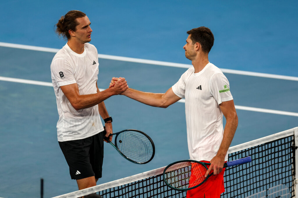Poland's Hubert Hurkacz (R) is congratulated by Germany's Alexander Zverev after his victory in men's singles match at the United Cup tennis tournament on Ken Rosewood Arena in Sydney on January 5, 2026.