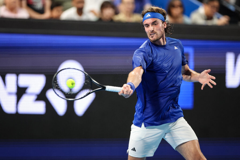 Greece's Stefanos Tsitsipas hits a return to Britain's Billy Harris during their men's singles match at the United Cup tennis tournament in Perth on January 5, 2026.
