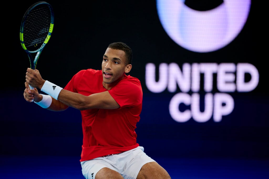 Felix Auger-Aliassime of Canada plays a backhand shot in the Group B singles match against Zizou Bergs of Belgium during the United Cup at Ken Rosewall Arena on January 06, 2026 in Sydney, Australia.