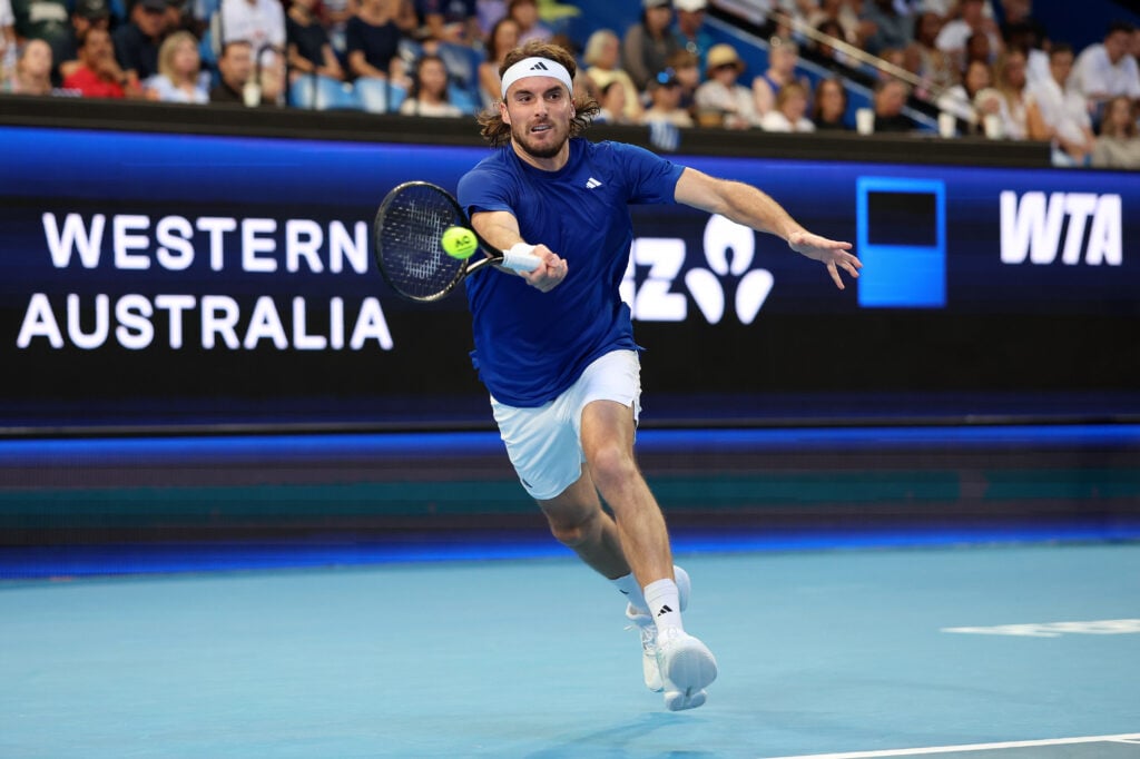 Stefanos Tsitsipas of Team Greece plays a forehand in the mixed doubles Quarter Final match against Coco Gauff & Christian Harrison of Team USA during Day 6 of the United Cup at RAC Arena on January 07, 2026 in Perth, Australia.