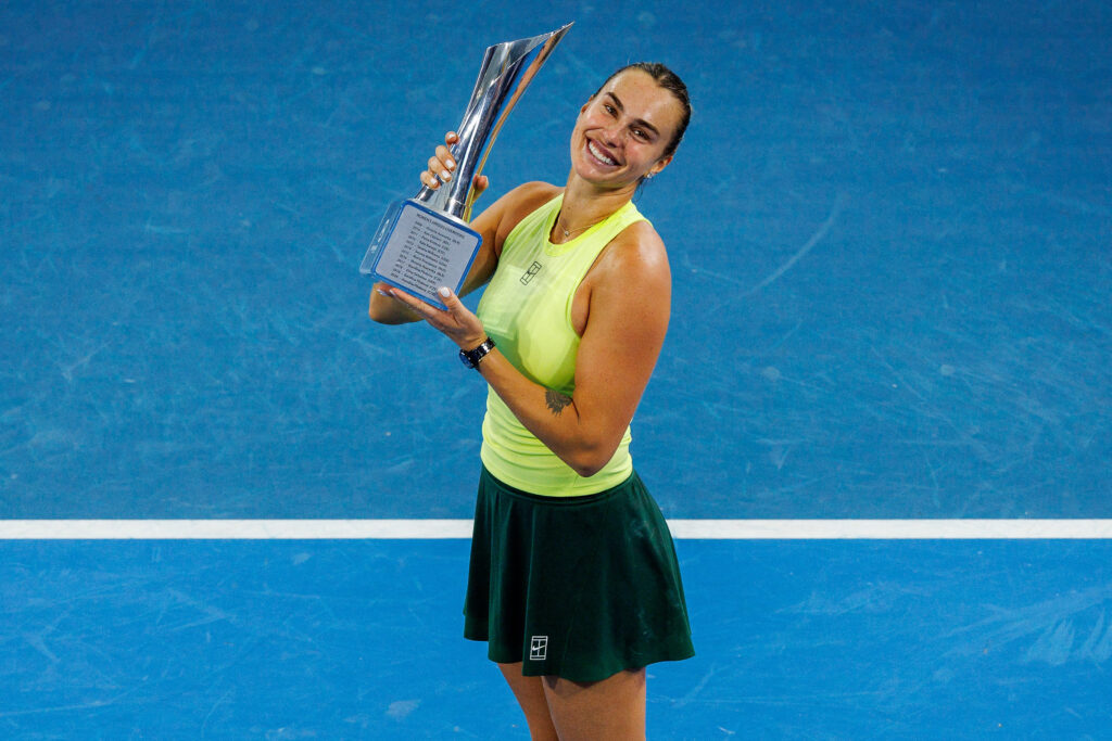 Aryna Sabalenka of Belarus celebrates with the trophy after winning the women's singles final against Marta Kostyuk of Ukraine at the Brisbane International tennis tournament in Brisbane on January 11, 2026.
