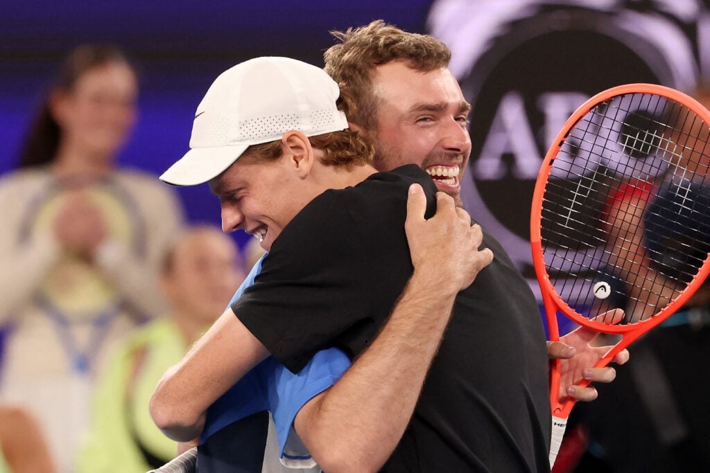 Italy's Jannik Sinner (R) embraces Australia's Jordan Smith during the 1 Point Slam exhibition event ahead of the 2026 Australian Open at Rod Laver Arena in Melbourne on January 14, 2026.