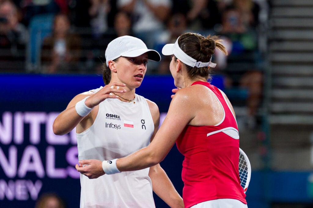 Belinda Bencic (R) of Team Switzerland shakes hand with Iga Swiatek of Team Poland after victory in the Women's Final Match during the United Cup at Ken Rosewall Arena on January 11, 2026 in Sydney, Australia.