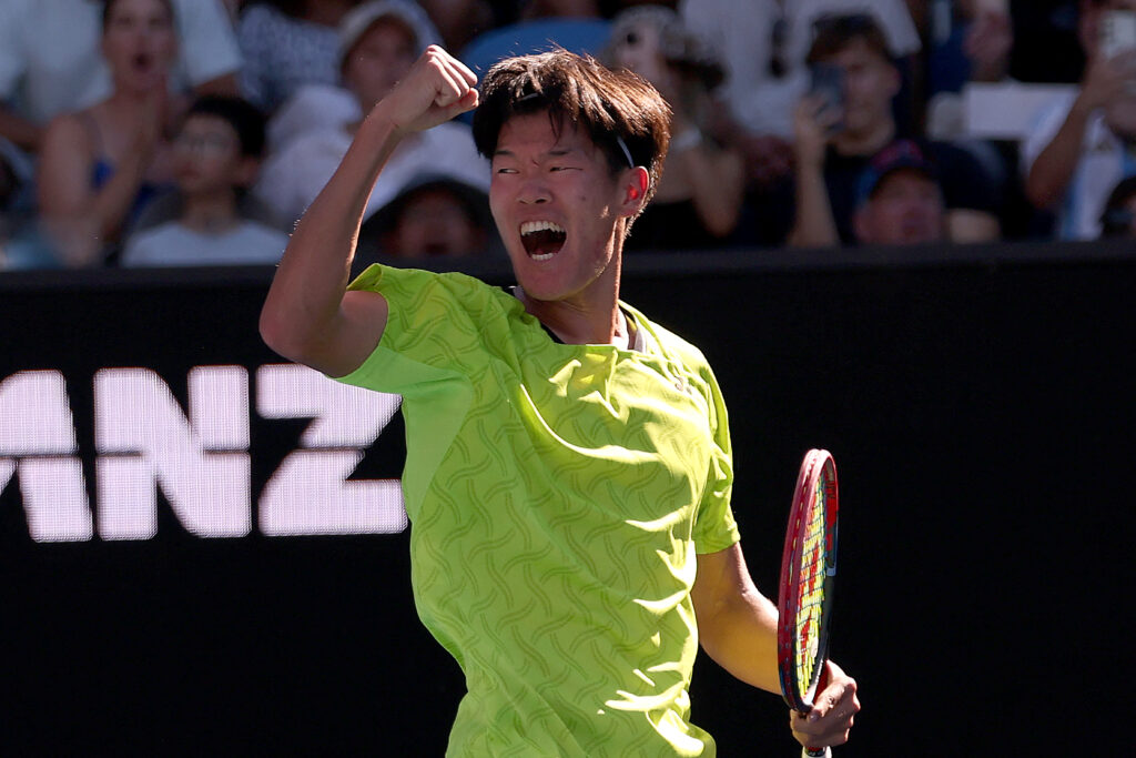 USA's Michael Zheng celebrates winning the second set against compatriot Sebastian Korda during their men's singles match on day one of the Australian Open in Melbourne on January 18, 2026.