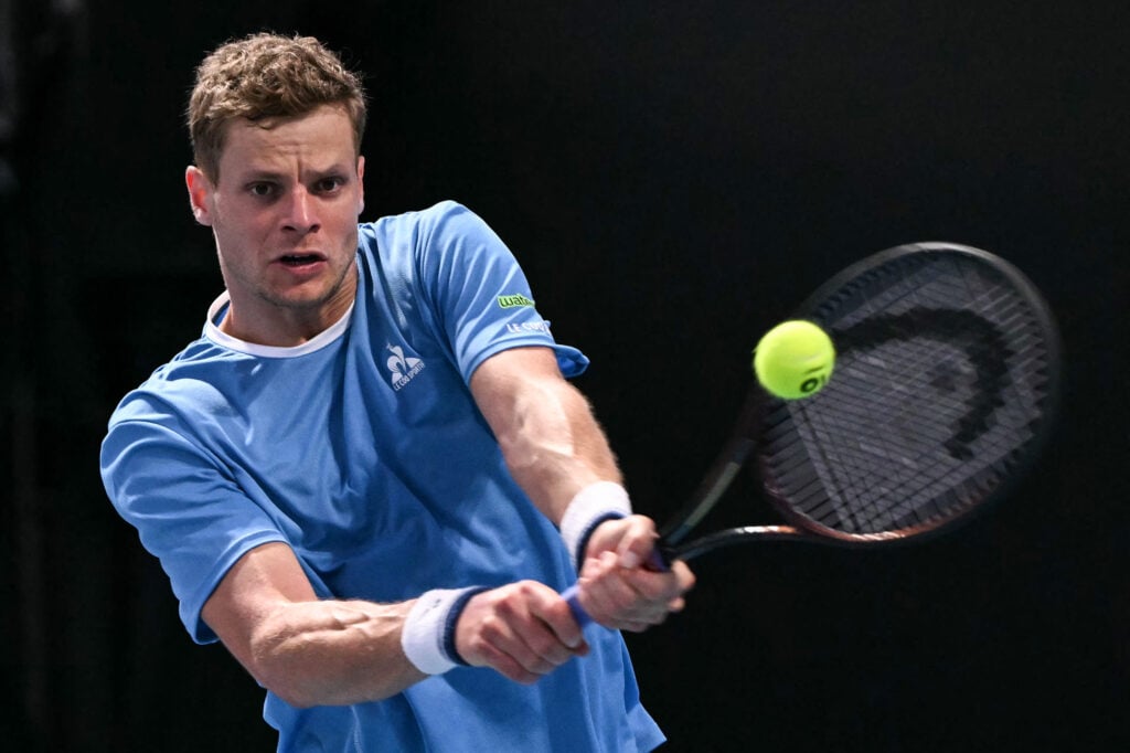 Germany's Yannick Hanfmann hits a return against USA's Zachary Svajda during their men's singles match on day one of the Australian Open tennis tournament in Melbourne on January 18, 2026.