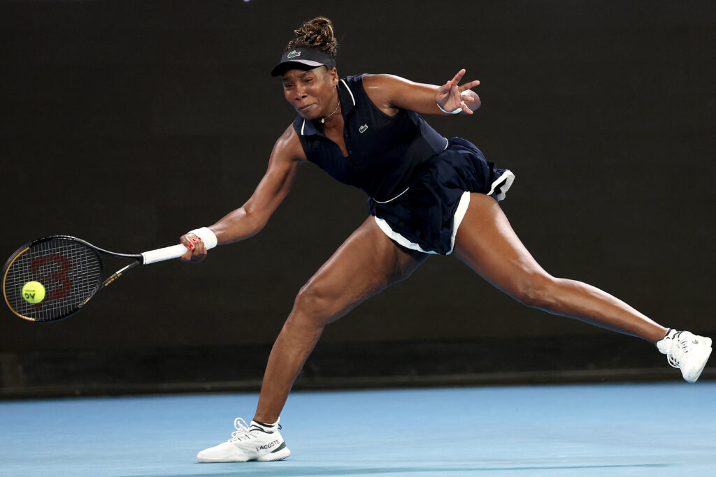 USA's Venus Williams hits a return to Serbia's Olga Danilovic during their women's singles match on day one of the Australian Open tennis tournament in Melbourne on January 18, 2026.