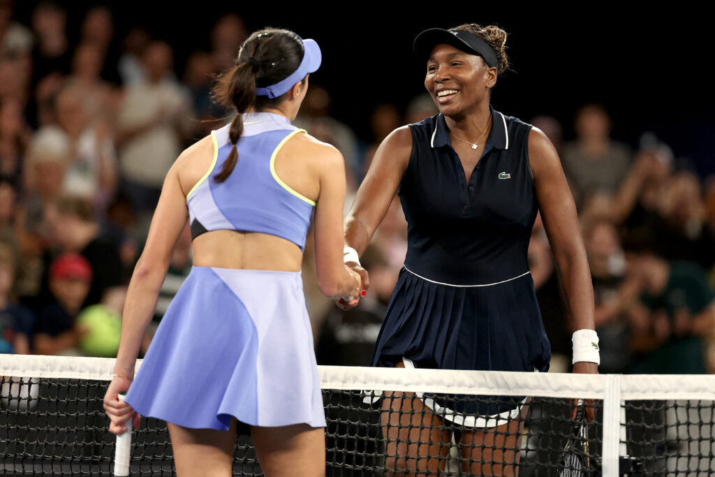 Serbia's Olga Danilovic (L) shakes hands with USA's Venus Williams after their women's singles match on day one of the Australian Open tennis tournament in Melbourne on January 18, 2026.