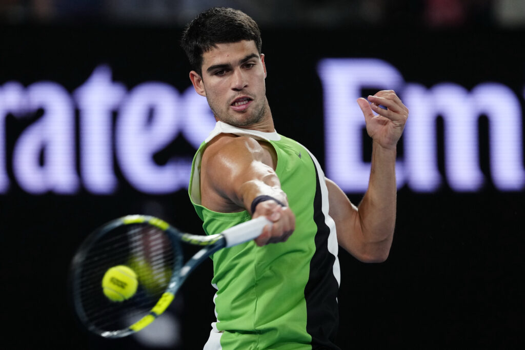 Carlos Alcaraz of Spain plays a forehand against Adam Walton of Australia during the Men's Singles First Round match on day one of the 2026 Australian Open at Melbourne Park on January 18, 2026 in Melbourne, Australia.