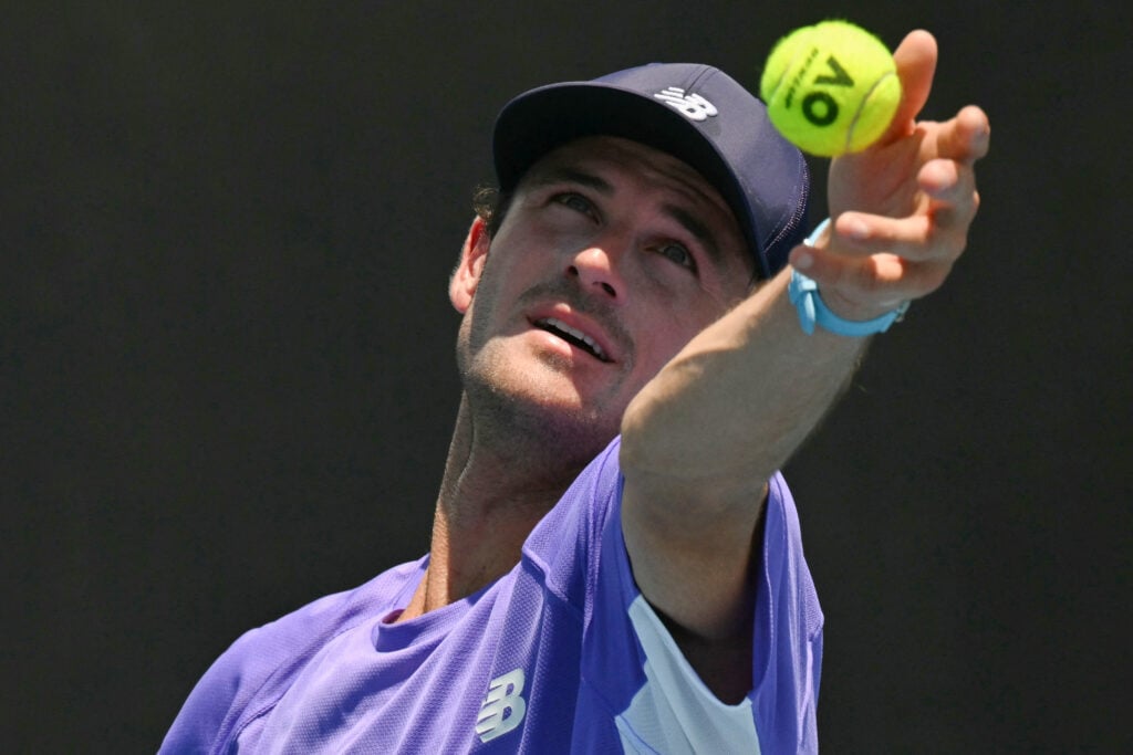 USA's Tommy Paul serves against compatriot Aleksandar Kovacevic during their men's singles match on day two of the Australian Open tennis tournament in Melbourne on January 19, 2026.