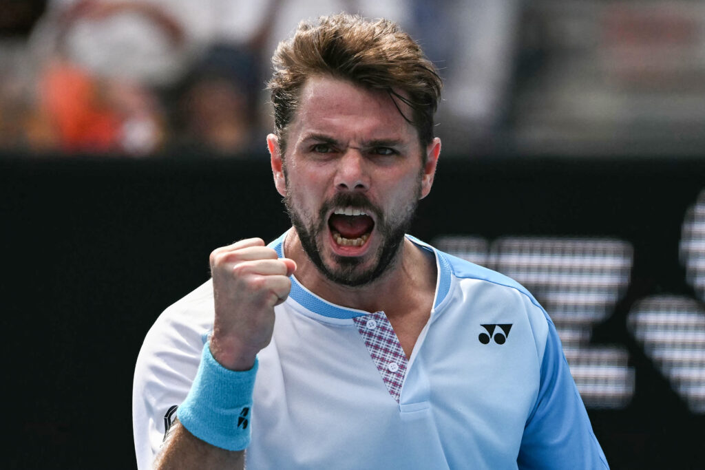 Switzerland's Stan Wawrinka reacts after a point against Serbia's Laslo Djere during their men's singles match on day one of the Australian Open tennis tournament in Melbourne on January 19, 2026.