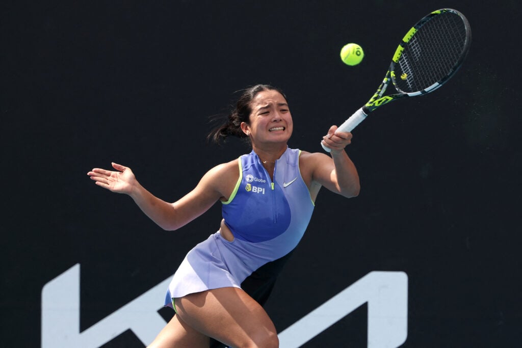 alex eala hits a forehand