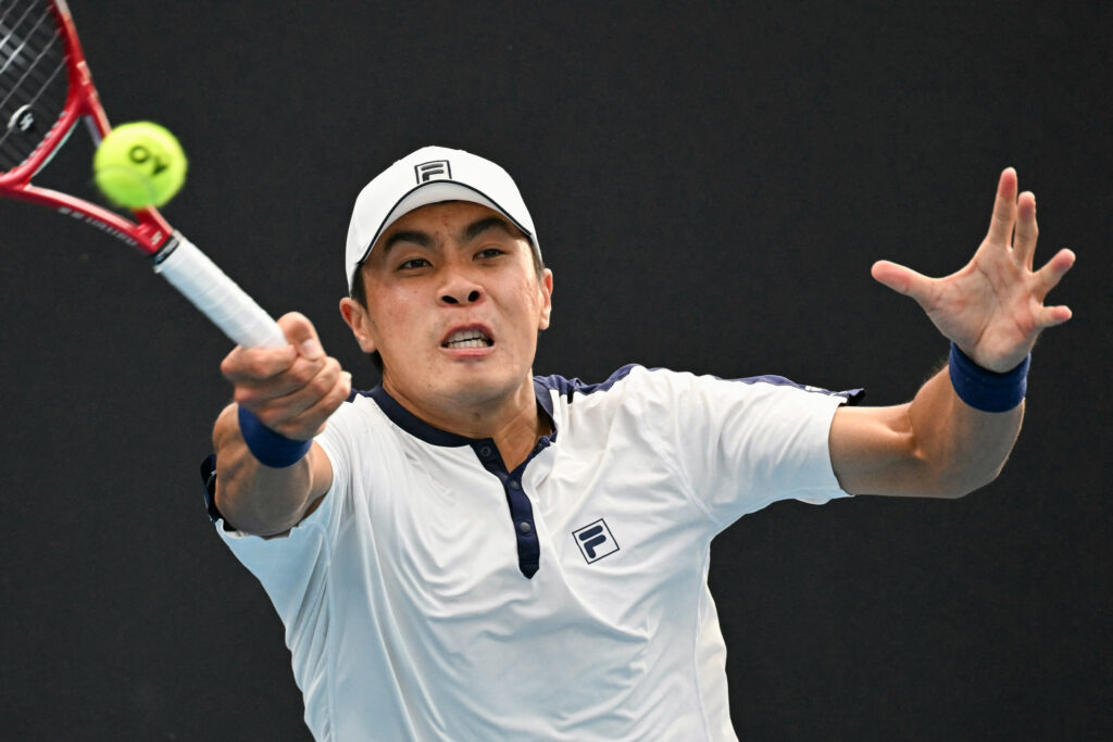 USA's Brandon Nakashima hits a return against Netherlands' Botic van de Zandschulp during their men's singles match on day two of the Australian Open tennis tournament in Melbourne on January 19, 2026.