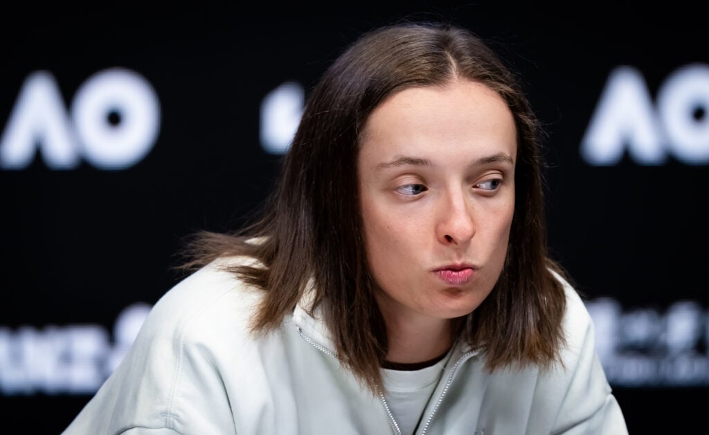 Iga Swiatek of Poland talks to the media after defeating Yue Yuan of China in the first round on Day 2 of the 2026 Australian Open at Melbourne Park on January 19, 2026 in Melbourne, Australia