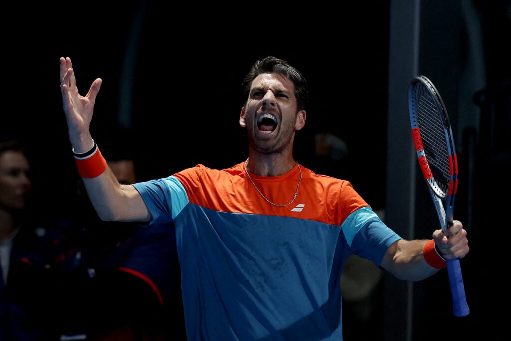 Britain's Cameron Norrie celebrates a match point against USA's Emilio Nava during their men's singles match on day four of the Australian Open tennis tournament in Melbourne on January 21, 2026.