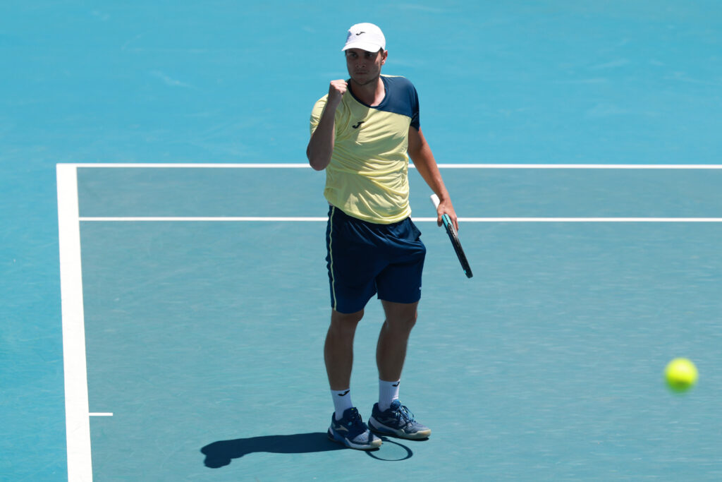 Miomir Kecmanovic of Serbia celebrates a point against Tomas Martin Etcheverry of Argentina in the Men's Singles First Round during day one of the 2026 Australian Open at Melbourne Park on January 18, 2026 in Melbourne, Australia.