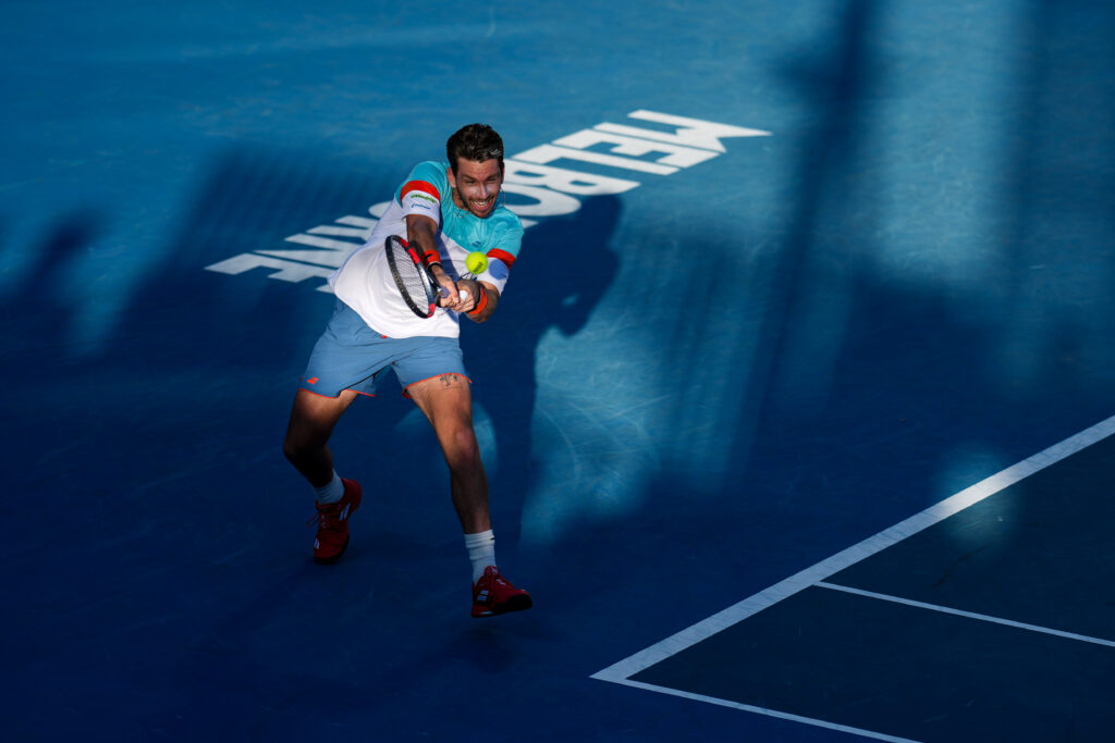Cam Norrie hits a backhand